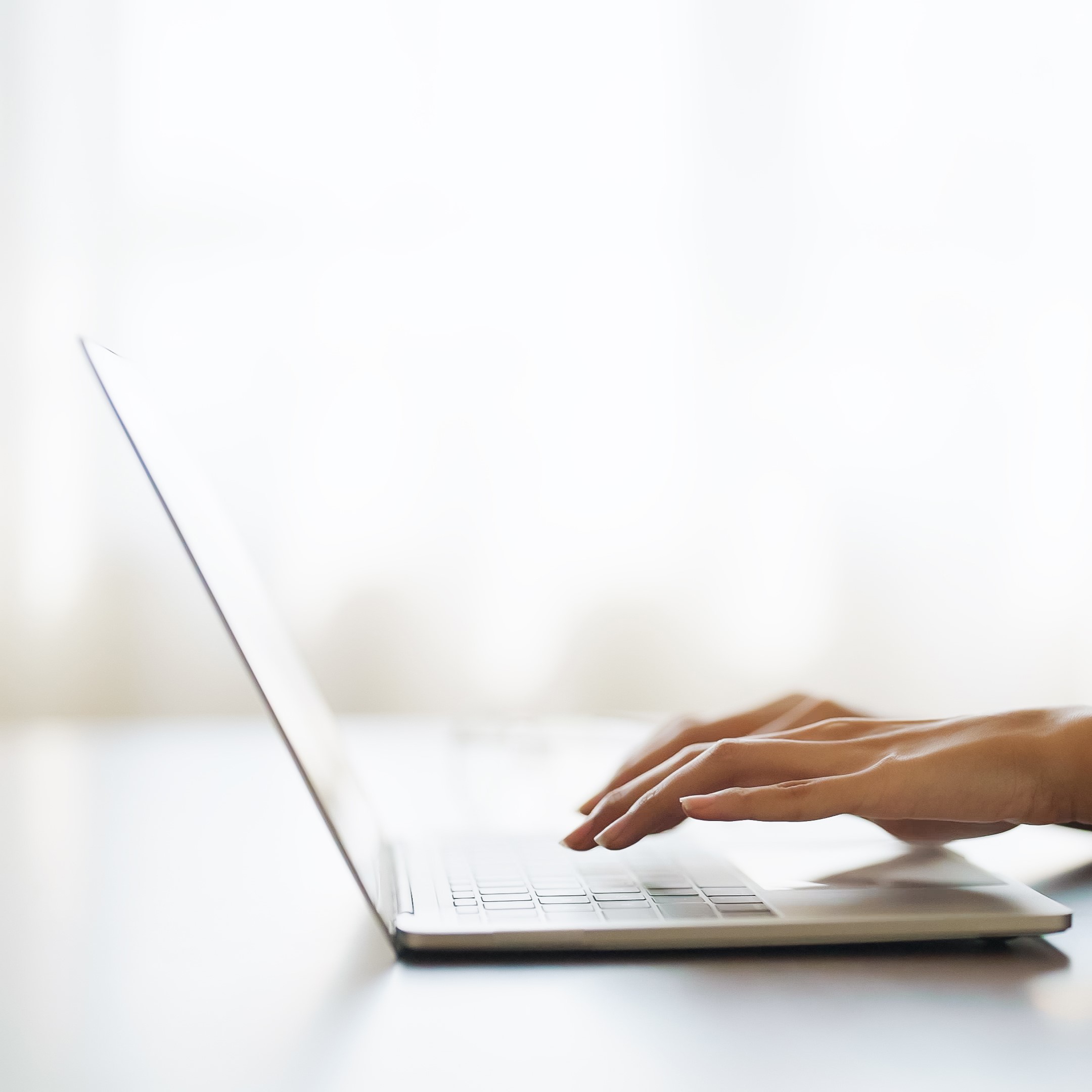 A woman searching on her laptop for "Free Parenting Classes in Picayune, Mississippi"