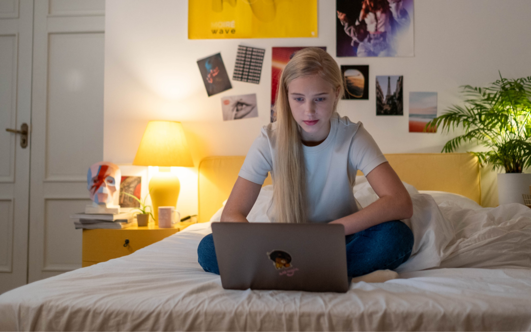 young girl looking at laptop